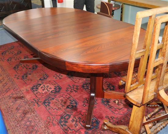 Kofod Larsen for Faarup Mobelfabrik, Denmark. A rosewood extending dining table, L 220cm (max) W 120cm